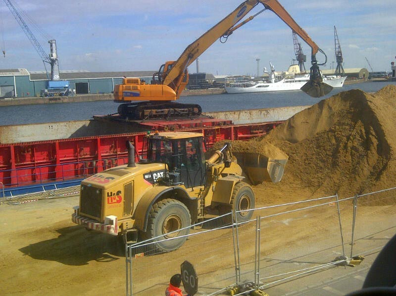 Construction site with an excavator and mechanical digger at Medway Chatham Docks.